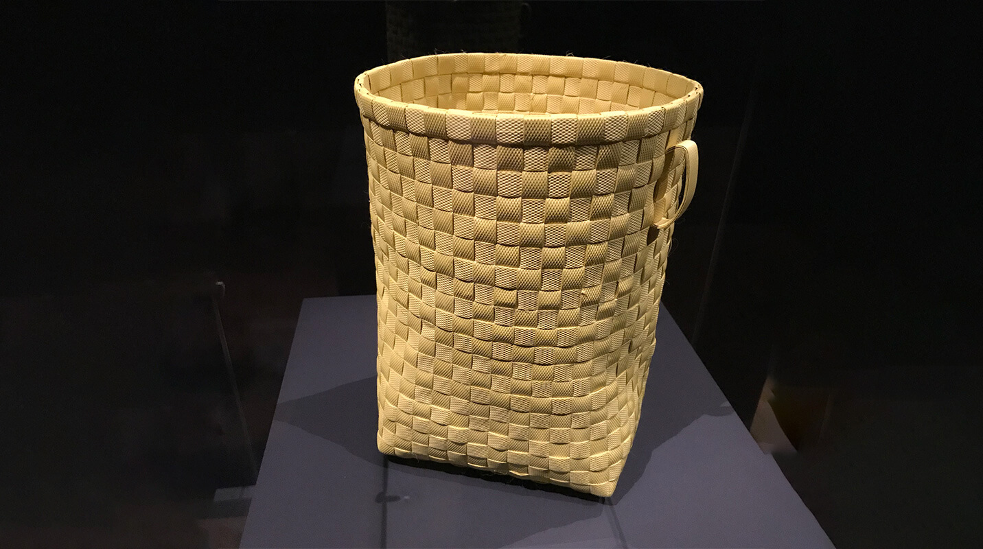 woven basket on pedestal